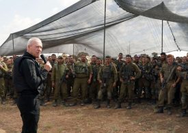 Israel’s defence chief tells troops they’ll see Gaza ‘from the inside soon’ as thousands gather at border