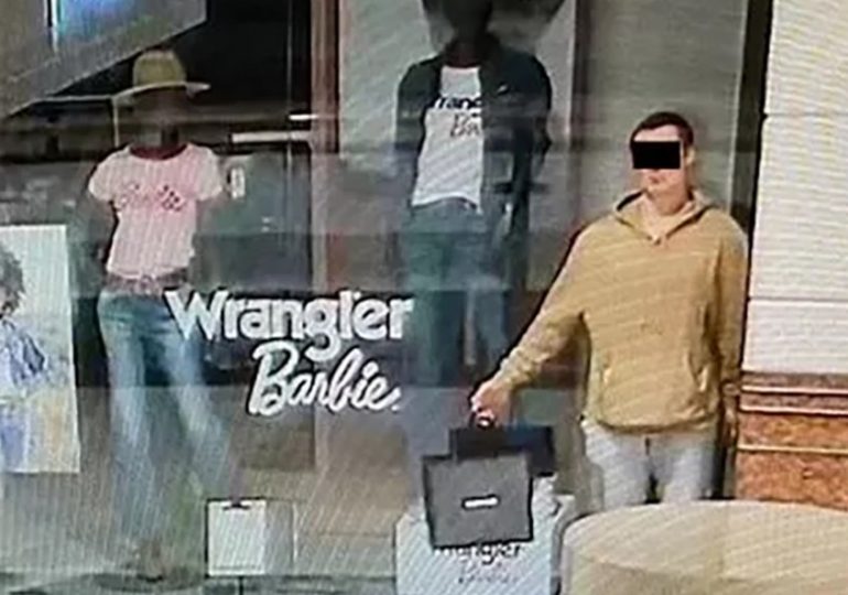 Moment ‘wiley burglar pretends to be a clothing MANNEQUIN in shop window before stealing jewellery after closing time’