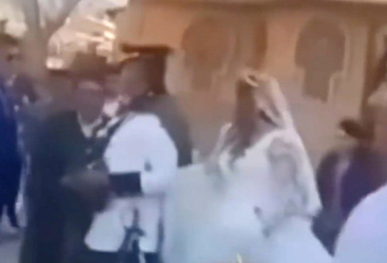Stomach-churning moment groom’s furious ex chucks bucket of oil and POO on his new bride as they leave church