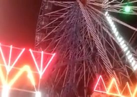 Heart-stopping moment rescuers climb Ferris wheel after carriages flip upside down leaving passengers dangling in Narela