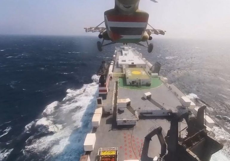 Moment Iran-backed militia drop from helicopter onto cargo ship owned by Israeli billionaire in dramatic mid-sea hijack