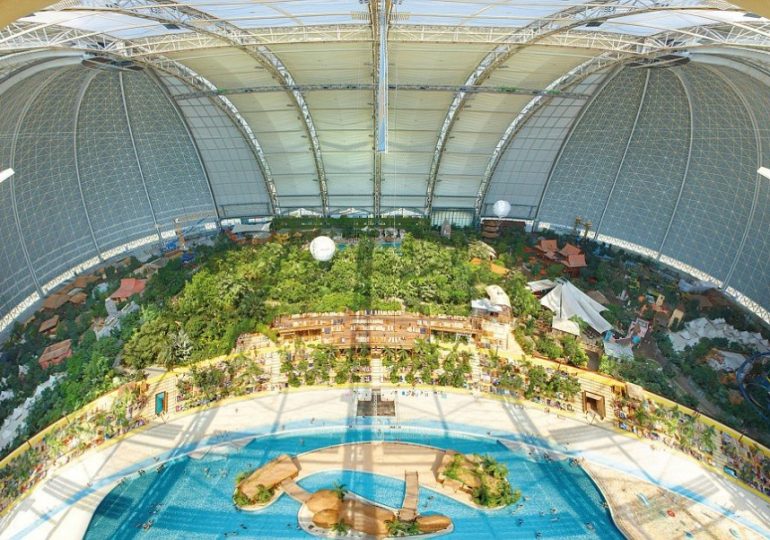 Inside world’s biggest indoor BEACH the size of 8 football pitches with 50k-plant forest & room to fly a hot air balloon