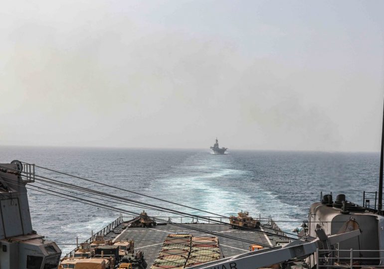 First deadly clash between US and Houthis as Navy choppers sink three terror boats KILLING militants storming cargo ship