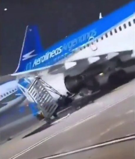 Terrifying moment Boeing 737 blows across airport in 100mph gales and smashes into staircase as deadly storm strikes