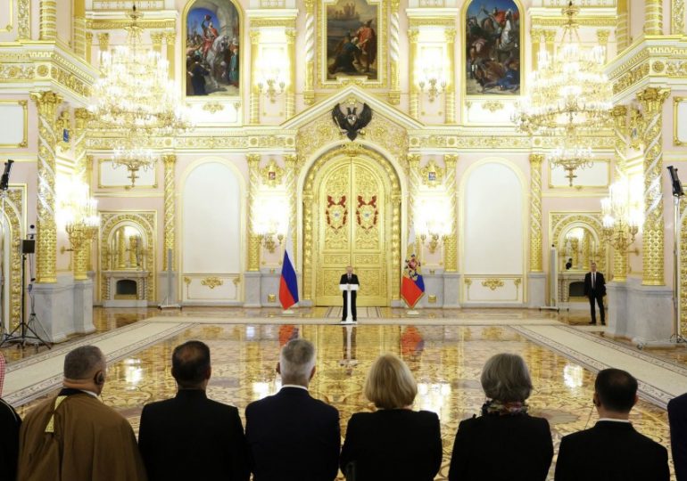 Putin health mystery deepens as ‘sickly’ Vlad hides 70ft away from UK ambassador – despite cuddling kids hours earlier