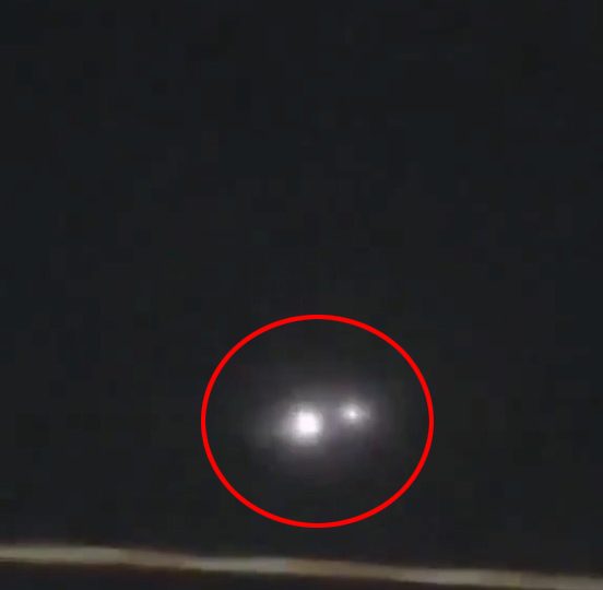 Bizarre footage shows mysterious ‘spinning UFO’ lighting up night sky over city in front of stunned crowd 