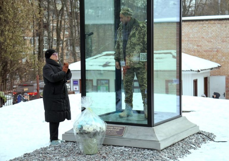 Grieving mum gazes at lifelike monument depicting war hero son — executed by Russians after declaring ‘Glory to Ukraine’