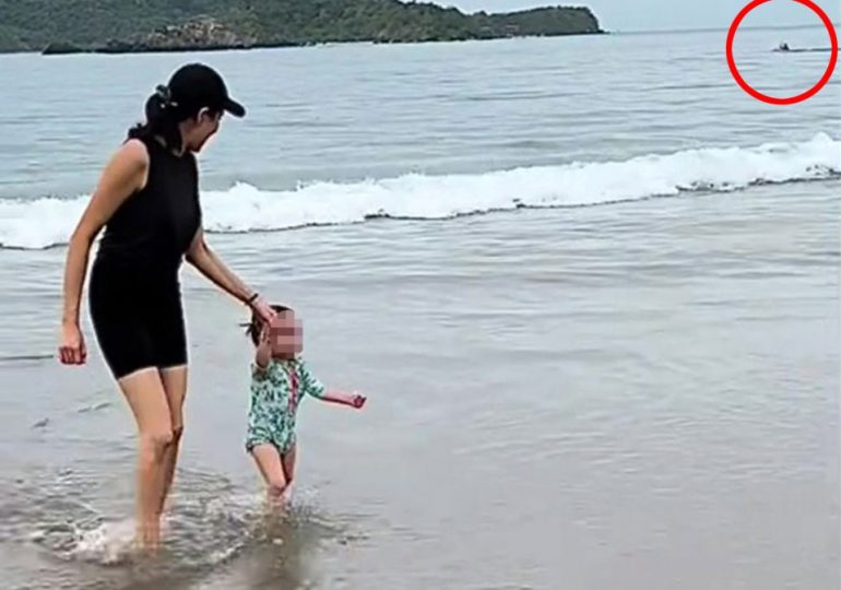 Chilling moment mum accidentally films deadly ‘shark attack’ that killed elderly tourist in background of her beach vid