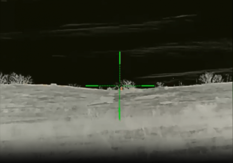 Moment Ukrainian sniper takes out Russian soldier from nearly a KILOMETRE away after spotting barely visible heat signal