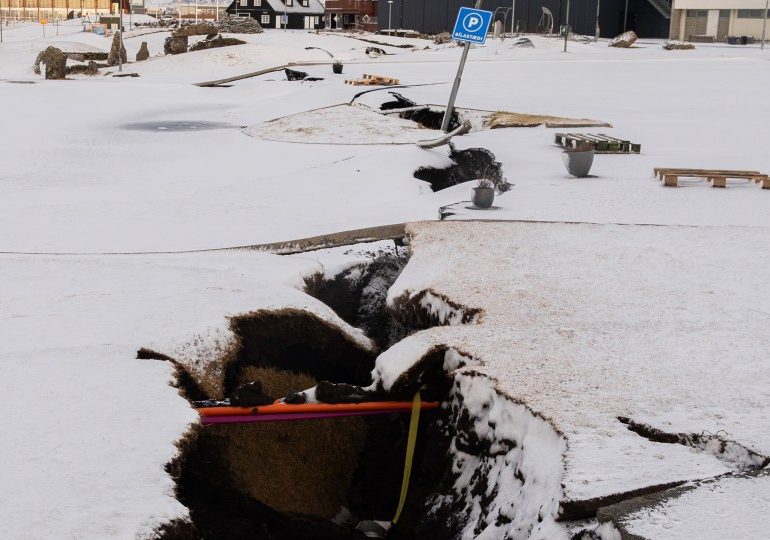 Road worker plunges into huge crack in Earth that split open during Iceland volcano eruption as frantic search launched