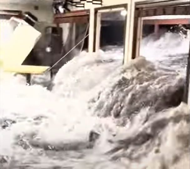 Horror moment freak waves pound army base smashing people through glass after swells come out of NOWHERE to swamp island