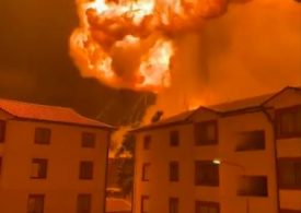 Terrifying mushroom cloud of flames erupts yards away from apartment blocks in Kenya as terrified residents flee