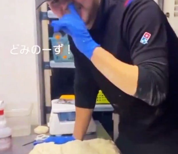 Horror moment Dominos worker is filmed picking his NOSE & wiping it on pizza dough forcing fast food giant to apologise