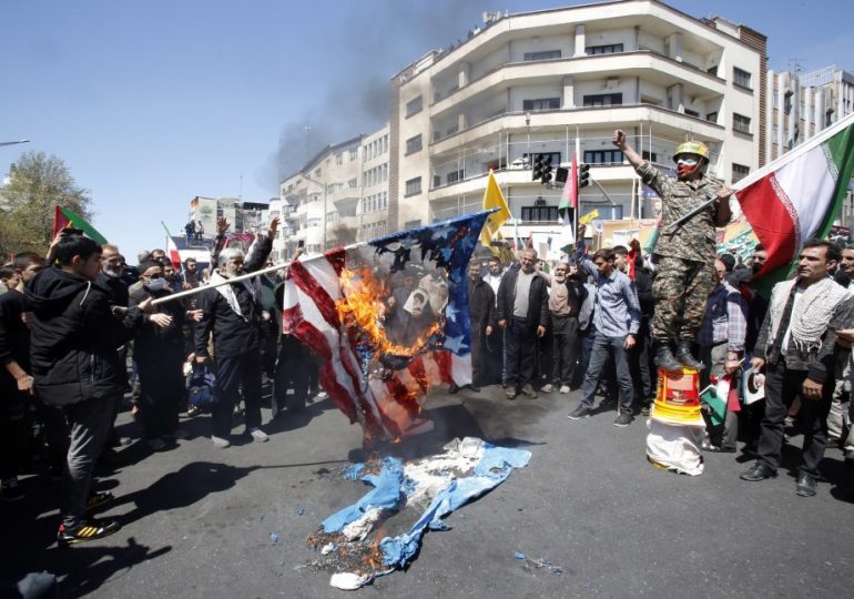 Iranians burn flags & drag ‘Zionist’ & US coffins as Revolutionary Guard leader vows to punish West with ‘wrath of God’