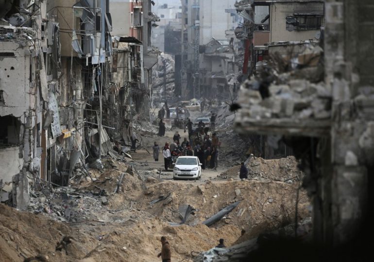 Thousands of Gaza families return to destroyed homes in blitzed city of Khan Younis after Israeli troops pull out