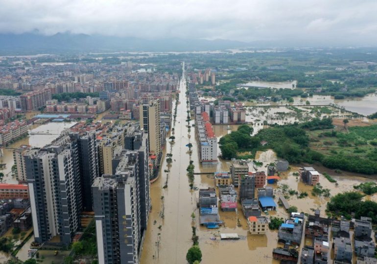 Shocking pics show bridges collapsing & homes underwater as ‘once in a century’ floods threaten 127million in China