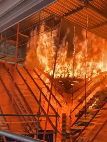 Watch terrifying moment builders caught up in Copenhagen fire flee realising spire is about to collapse