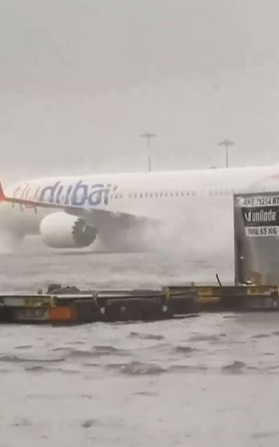 Dubai Airport left UNDERWATER as storm rains & flash floods turn runway into lake leaving flights suspended