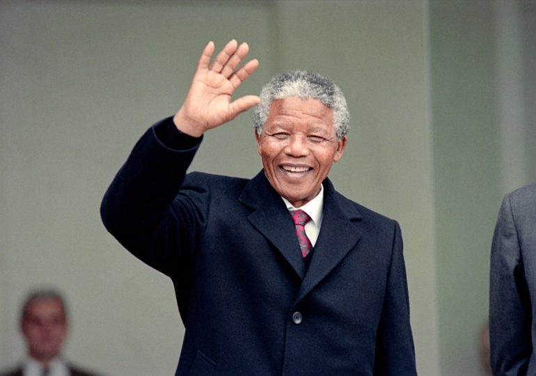 Why did Nelson Mandela go to prison and when was he released?