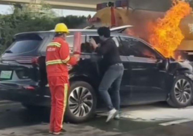Dramatic moment motorists try to rescue family from burning EV after horror crash before flames engulf car killing three