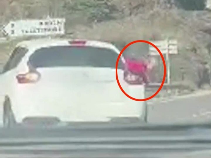 Watch horror moment toddler, 2, FALLS head-first out of moving car onto road after mum ‘didn’t strap her into car seat’