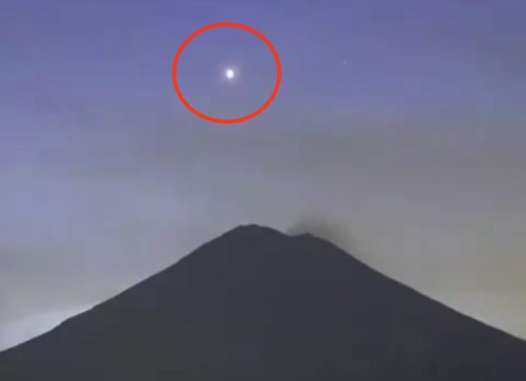 Watch bizarre moment glowing UFO ‘flies into active volcano’ that researcher claims is a ‘wormhole’ for alien spacecraft