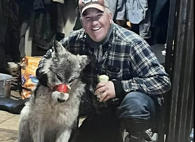 Cruel hunter parades tortured wolf with TAPE around its mouth before taking wounded animal to bar & finally killing it