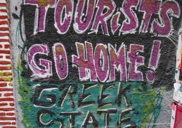 Chilling anti-tourist graffiti appears in ANOTHER Brit hols hotspot saying ‘GO HOME’ as protests spread to Greece