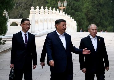 Bizarre moment Xi and Putin go in for TWO HUGS in unprecedented touchy-feely embrace during despots’ love-in talks