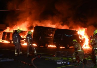 Masked anarchists torch 16 Amazon delivery vans in arson attack as cops break up ‘Black Bloc’ march
