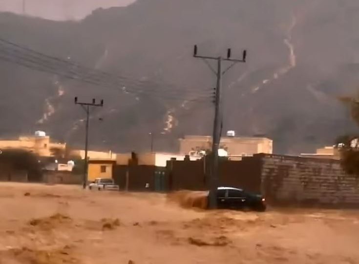 Watch moment cars are swept away & roads become raging rivers as floods swamp Saudi Arabia as storms batter Dubai