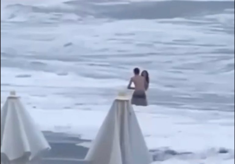 Tragic moment woman is swept out to sea to her death just seconds after romantic kiss with boyfriend on the beach