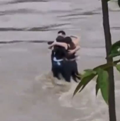 Harrowing moment pals cling to each other in final embrace before being swept away by horror flash floods in Italy