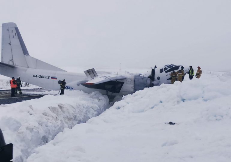 Chilling photos show plane snapped in two after horror crash in the arctic tundra as 41 passengers miraculously survived