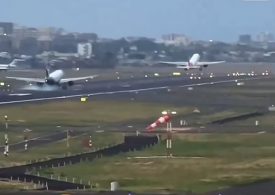 Terrifying moment passenger plane lands just metres behind another at Mumbai airport in heart-stopping near-miss