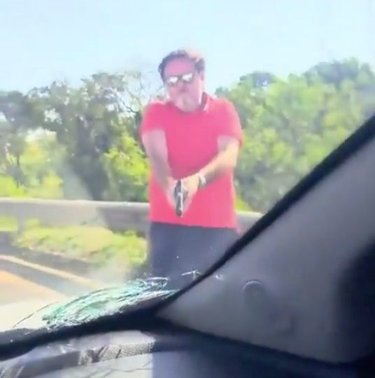 Horror moment road rage driver pulls GUN on terrified couple before blasting windscreen as they’re on the phone to cops