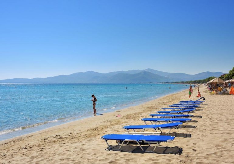 Mystery as man’s body found in water near popular Greek beach with 10kg barbell tied to his leg as cops launch probe