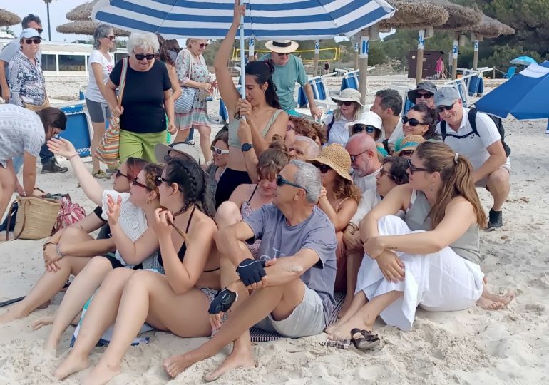 Moment furious protesters OCCUPY Majorca beach loved by Brits amid anti-tourist uprising ahead of summer hols rush