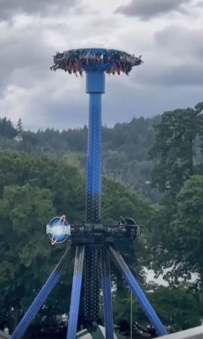 Horror moment 28 thrillseekers are left dangling upside down 100ft in the air after theme park ride breaks down