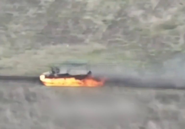 Moment maniac Russian soldier drives flaming ‘chariot of fire’ across battlefield after being hit by kamikaze drone