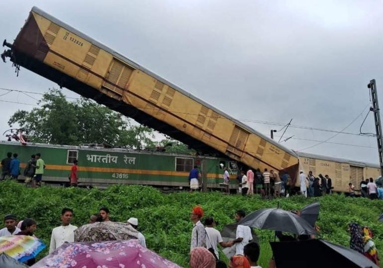 At least 5 dead & 30 injured in horror train pile-up leaving one carriage jammed vertically into the air in India crash