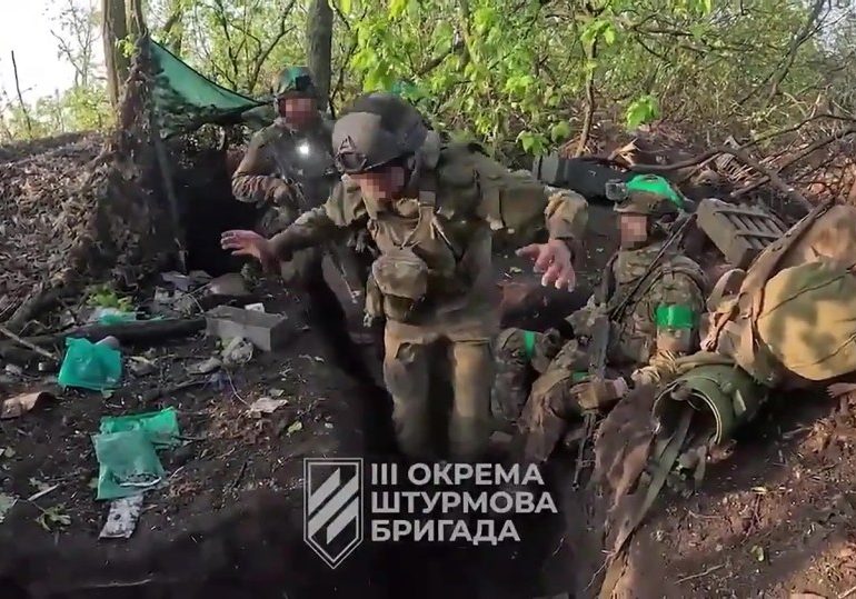 Russian soldiers seen surrendering when their trenches were overrun in Ukraine