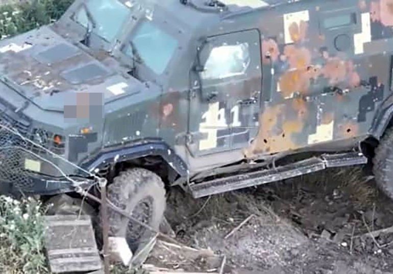 Putin’s troops ‘given orders to DECAPITATE Ukrainian soldiers’ as harrowing pic of severed head on Russian truck emerges