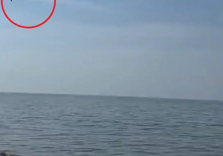 Watch terrifying moment low-flying 700mph Russian cruise missiles skim over fishermen’s heads on way to blast Ukraine