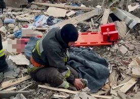 Harrowing moment firefighter cries over wife’s body after being called out to missile strike on his own house in Ukraine