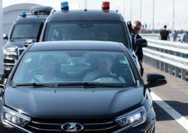 Putin makes major driving error while zooming around in new Lada to promote Russian cars – can YOU spot the error?