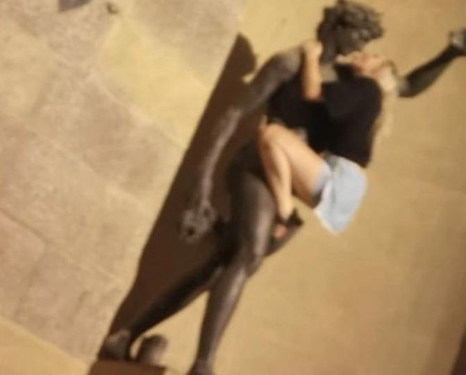 Moment female holidaymaker pretends to ROMP with iconic Florence statue sparking furious demands for tourist crackdown