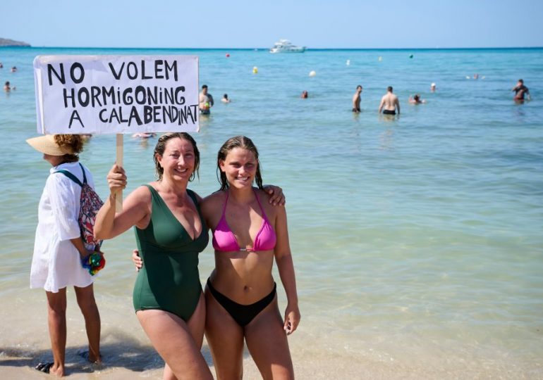 Anti-tourist protesters storm ‘drunk beach’ in Majorca over ‘low quality’ visitors as Brits flock there on hols