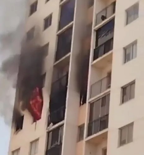 Couple leap to their death with baby son in desperate bid to escape 7th-floor apartment inferno in front of onlookers