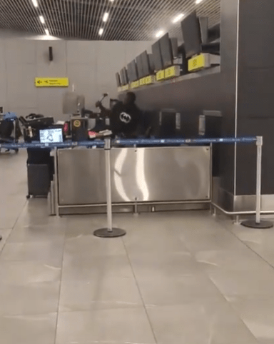 Watch as passenger goes on hammer RAMPAGE at airport smashing check-in desk after ‘realising he’d been sold fake ticket’